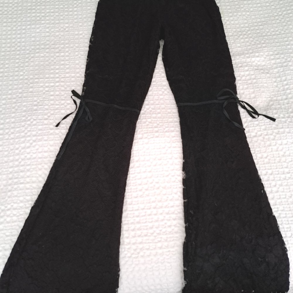 Unique black lace flare pants with cute bow ties at knee. Elastic waist. Sz S